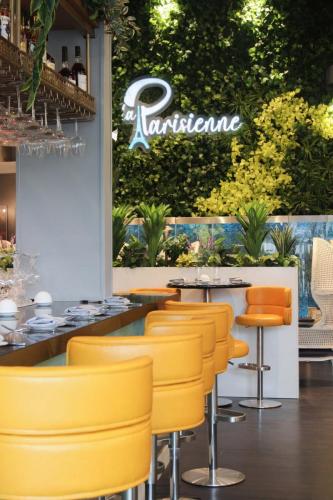 line of buttery yellow PU and chrome barstools